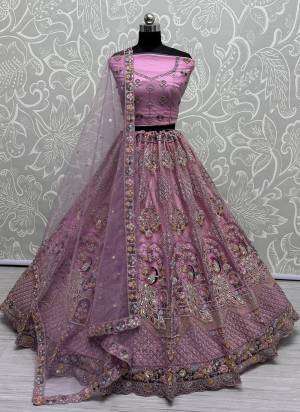 For A Fancy Designer Look,Grab These Lehenga Choli With Dupatta in Fine Colored.These Lehenga And Choli Are Net And Dupatta Are Fabricated On Net Pair.Its Beautified With Designer Sequance,Multy Thread,Dori Embroidery,Zarkan Work.