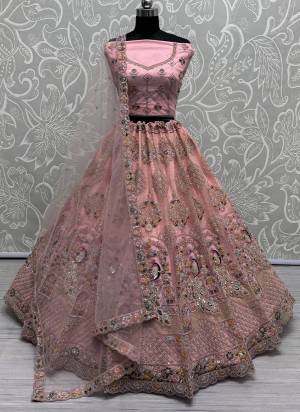 For A Fancy Designer Look,Grab These Lehenga Choli With Dupatta in Fine Colored.These Lehenga And Choli Are Net And Dupatta Are Fabricated On Net Pair.Its Beautified With Designer Sequance,Multy Thread,Dori Embroidery,Zarkan Work.