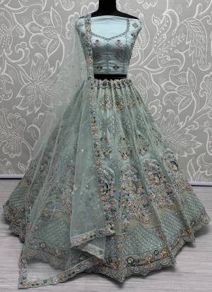 For A Fancy Designer Look,Grab These Lehenga Choli With Dupatta in Fine Colored.These Lehenga And Choli Are Net And Dupatta Are Fabricated On Net Pair.Its Beautified With Designer Sequance,Multy Thread,Dori Embroidery,Zarkan Work.