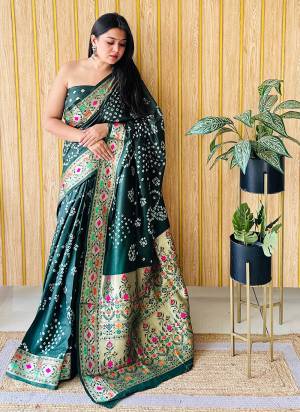 Garb These Party Wear Saree in Fine Colored.These Saree And Blouse is Fabricated On Silk.Its Beautified With Wevon Paithani Designer With Original Bandhej Disigner.