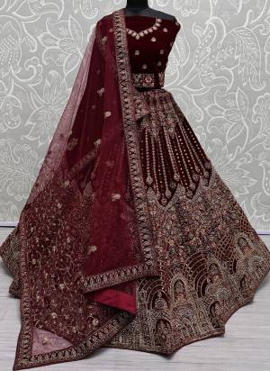 For A Fancy Designer Look,Grab These Lehenga Choli With Dupatta in Fine Colored.These Lehenga And Choli Are Velvet And Dupatta Are Fabricated On Soft Net & Velvet Pair.Its Beautified With Designer Mirror Hand Work,Fancy Dori,Jari Embroidery With Motif,Heavy Diamond Work.