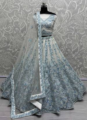 For A Fancy Designer Look,Grab These Lehenga Choli With Dupatta in Fine Colored.These Lehenga Are Net And Choli Are Net And Dupatta Are Fabricated On Soft Net Pair.Its Beautified With Designer Fancy Flowar Tone To Tone Sequance,Multy Thread,Dori Embroidery Work.