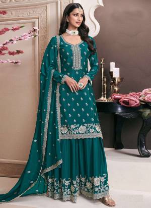 Garb These Designer Plazzo Suits in Fine Colored Pair With Dupatta.These Top Are Chinon And Dupatta Are Fabricated On Chinon Pair With Chinon Bottom.Its Beautified With Heavy Designer Embroidery Work