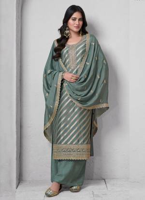  Looking These Party Wear Suit in Fine Colored Pair With Bottom And Dupatta.These Top Are Lotus Silk Jacquard And Dupatta Are Fabricated On Rangoli Georgette Pair With Santoon Bottom.Its Beautified With Wevon Jacquard Designer, Embroidery Work.