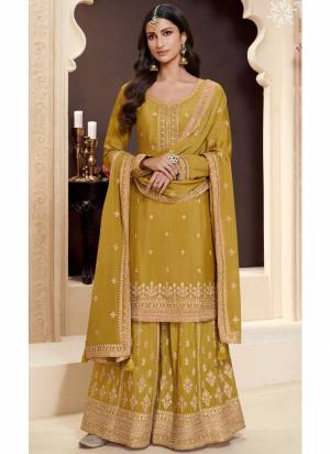 Looking These Party Wear Sharara Suit in Fine Colored Pair With Bottom And Dupatta.These Top Are Chinon And Dupatta Are Fabricated On Chinon Pair With Chinon Bottom.Its Beautified With Heavy Designer Embroidery Work.