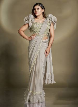 Look Attrective These Designer Party Wear Ready To Wear Saree With Blouse in Fine Colored.These Saree Are Two Tone Satin Silk And Blouse Crepe is Fabricated.Its Beautified Solid,Desiger Sequance,Beads,Aari Hand Work And Belt.