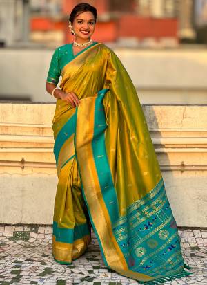 Garb These Party Wear Saree in Fine Colored.These Saree And Blouse is Fabricated On Paithani Silk.Its Beautified With Weaving Gold Jari Peacock Designer.