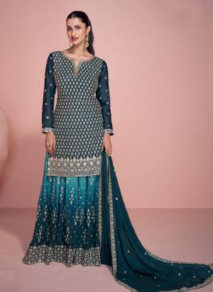 Morpich Colored Palazo Suit is prettified with Embroidery work,Zari And Sequence Work as shown which makes it appear classy. This top is made of Chinon fabric which is accompanied with Chinon Bottom,Santoon Inner and Chinon dupatta. Women can buy this suit to wear for their parties and functions.
