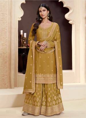 Yellow Colored Palazo Suit is prettified with Embroidery work,Zari And Sequence Work as shown which makes it appear classy. This top is made of Chinon fabric which is accompanied with Chinon Bottom,Santoon Inner and Chinon dupatta. Women can buy this suit to wear for their parties and functions.