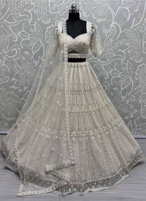 For A Fancy Designer Look,Grab These Lehenga Choli With Dupatta in Fine Colored.These Lehenga And Choli Are Net And Dupatta Are Fabricated On Soft Net Pair.Its Beautified With Heavy Fancy Designer Sequance Embroidery,Hand Work.