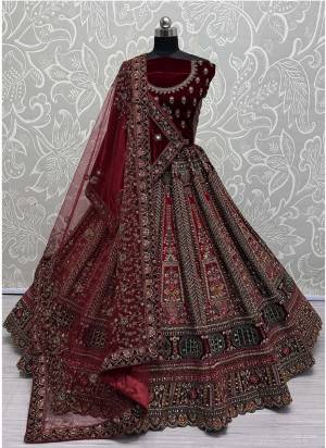 For A Fancy Designer Look,Grab These Lehenga Choli With 2 Dupatta in Fine Colored.These Lehenga And Choli Are Velvet And Dupatta Are Fabricated On Soft Net & Velvet Pair.Its Beautified With Designer Sequance,Multy Thread,Dori,Patch,Hand Mirrar Embroidery With Diamond Work. 