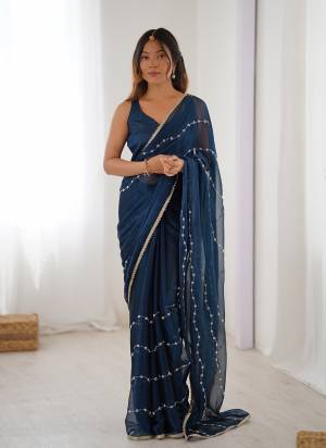 Looking These Party Wear Saree in Fine Colored.These Saree Are Sitara Chiffon And Blouse is Mono Banglori Fabricated.Its Beautified With Designer Beads Moti,Val Sequance Embroidery Work With Codding Lace Border.
