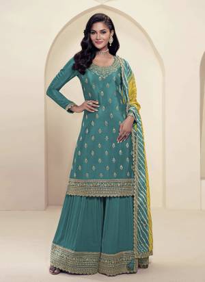 Looking These Party Wear Plazzo Suit in Fine Colored Pair With Dupatta.These Top Are Chinon And Dupatta Are Chiffon And Pair With Chinon Bottom.Its Beautified With Designer Embroidery Work With Printed Dupatta.