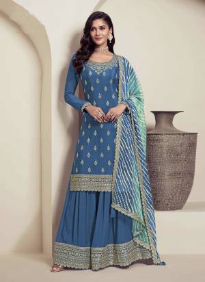 Looking These Party Wear Plazzo Suit in Fine Colored Pair With Dupatta.These Top Are Chinon And Dupatta Are Chiffon And Pair With Chinon Bottom.Its Beautified With Designer Embroidery Work With Printed Dupatta.