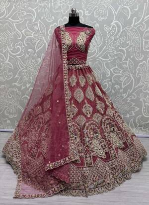For A Fancy Designer Look,Grab These Lehenga Choli With Dupatta in Fine Colored.These Lehenga And Choli Are Net And Dupatta Are Fabricated On Soft Net Pair.Its Beautified With Designer Peacock Pattern,Sequance,Multy Thread,Dori,Jari Embroidery With Diamond Work. 