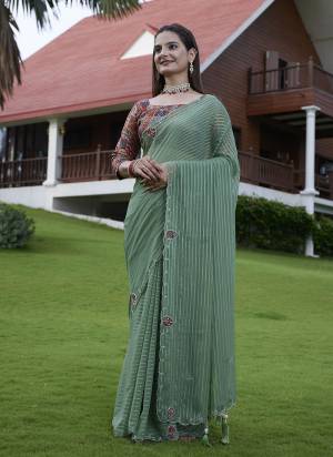Looking These Party Wear Saree in Fine Colored Pair With Blouse.These Saree Are Georgette and Blouse Are Fabricated On Gajji Silk.Its Beautified With Wevon Lining Designer With Calcutta Zardishi,Diamond Hand Embroidery Work.