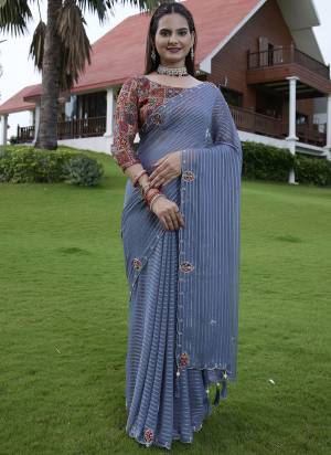 Looking These Party Wear Saree in Fine Colored Pair With Blouse.These Saree Are Georgette and Blouse Are Fabricated On Gajji Silk.Its Beautified With Wevon Lining Designer With Calcutta Zardishi,Diamond Hand Embroidery Work.