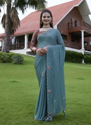 Looking These Party Wear Saree in Fine Colored Pair With Blouse.These Saree Are Georgette and Blouse Are Fabricated On Gajji Silk.Its Beautified With Wevon Lining Designer With Calcutta Zardishi,Diamond Hand Embroidery Work.