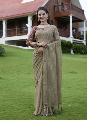 Looking These Party Wear Saree in Fine Colored Pair With Blouse.These Saree Are Georgette and Blouse Are Fabricated On Gajji Silk.Its Beautified With Wevon Lining Designer With Calcutta Zardishi,Diamond Hand Embroidery Work.