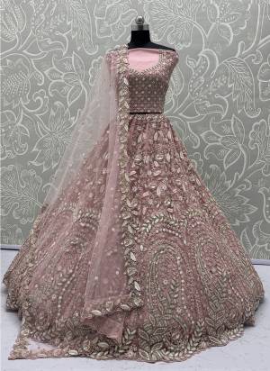 For A Fancy Designer Look,Grab These Lehenga Choli With Dupatta in Fine Colored.These Lehenga And Choli Are Net And Dupatta Are Fabricated On Soft Net Pair.Its Beautified With Fancy Designer Peacock Thread,Sequance,Dori Embroidery With Zarkan Diamond Work. 