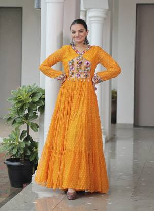 Attractive These Beautiful Looking Free Size Stitched Long Gown.These Gown is Fabricated On Faux Georgette.Its Beautified With Bandhani Printed Designer With Kutchi Patch Work.