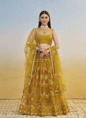 For A Different Look,Grab These Party Wear Designer Lehenga in All Over Pretty Colored Pair With Blouse And Dupatta.These Lehenga Choli And Dupatta is All Over Butterfly Net Base Fabric With Designer Cotton Thread,Sandwitch Sequance Embroidery Work.