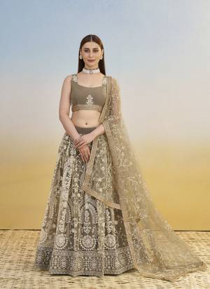 For A Different Look,Grab These Party Wear Designer Lehenga in All Over Pretty Colored Pair With Blouse And Dupatta.These Lehenga Choli And Dupatta is All Over Butterfly Net Base Fabric With Designer Cotton Thread,Sandwitch Sequance Embroidery Work.
