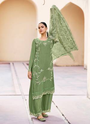 Attrective Looking These Plazzo Suit in Fine Colored Pair With Bottom And Dupatta.These Top And Bottom Are Fabricated On Chinon Pair With Organza Dupatta.Its Beautified With Designer Embroidery Work With Printed Dupatta.