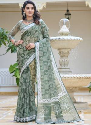 Garb These Fastive Saree in Fine Colored.These Saree Are Linen Cotton And Blouse is Fabricated On Linen Cotton Pair.Its Beautified With Wevon Jari Border With Designer Digital Printed.