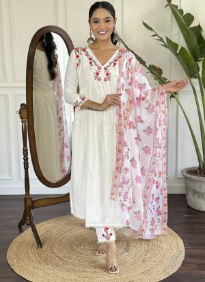Garb These Suit in Fine Colored Pair With Bottom And Dupatta.These Top And Bottom Are Fabricated On Viscose Rayon Pair With Silk Dupatta.Its Beautified With Designer Embroidery Work.