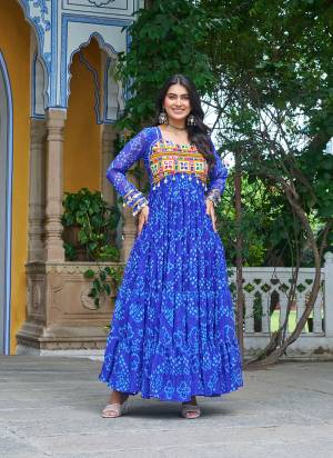 Garb These Beautiful Looking Readymade Navrati Long Gown.These Gown is Fabricated On Faux Georgette.Its Beautified With Bandhani Printed Designer, Kutchi Patch Work.
