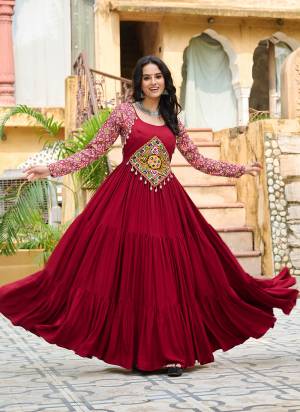 Garb These Beautiful Navratri Wear Readymade Long Gown.These Gown is Fabricated On Rayon.Its Beautified With Designer Kutchi Gamthi Embroidery Work.
