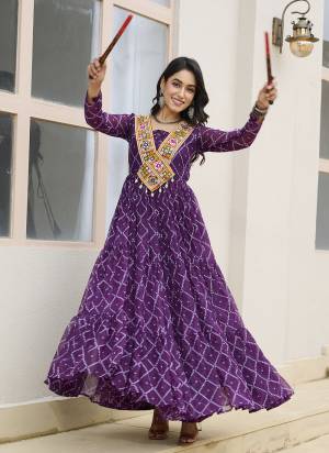Garb These Beautiful Looking Readymade Navrati Long Gown.These Gown is Fabricated On Faux Georgette.Its Beautified With Bandhani Printed Designer, Kutchi Patch Work.