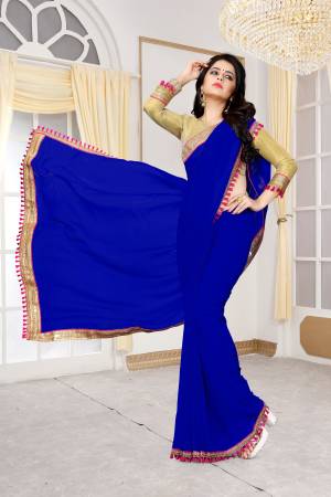 Shine Bright Wearing This Vibrant Colored Saree In Royal Blue Color Paired With Golden Colored Blouse. This  Saree Is Fabricated On Georgette Paired With Brocade Fabricated Blouse. It Has Attractive Lace Border. Buy This Pretty Saree Now.