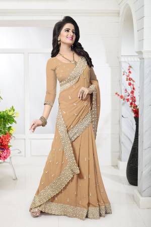 Simple And Elegant Looking Saree Is Here Beige Color Paired With Beige Colored Blouse. This Saree And Blouse Are Fabricated On Georgette Beautified With Heavy Moti Work Which Is Elegant And Classy And As It Is In Beige Color It Will Give You A Rich Look Like Never Before.