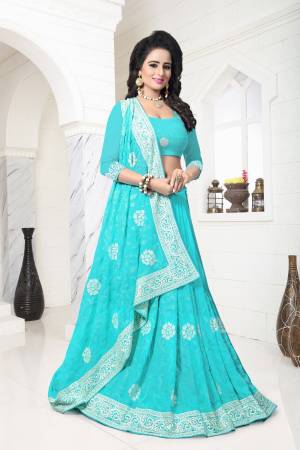 Grab This Pretty Saree In Turquoise Blue Color Paired With Turquoise Blue Colored Blouse. This Saree And Blouse Are Fabricated On Georgette Beautified With Heavy Thread Work Over The Lace Border. Buy This Designer Saree Now.