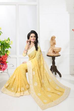 Celebrate This Festive Season Wearing This Saree In Yellow Color Paired With Yellow Colored Blouse. This Saree And Blouse Are Fabricated On Georgette Beautified With Heavy Thread  Work All Over Its Lace Border And Scattered Over The Saree.