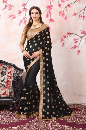 Enhance Your Beauty Wearing This Saree In Black Color Paired With Golden Colored Blouse. This Saree Is Fabricated On Georgette Paired With Brocade Fabricated Blouse. This Saree Is Simple Jari Work And Lace Border. Buy This Saree Now.