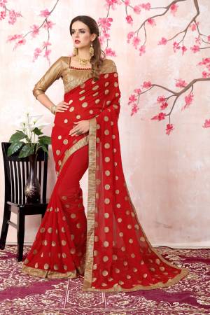 Adorn The Pretty Angelic Look Wearing This Saree In Red Color Paired With Golden Colored Blouse. This Saree Is Fabricated On Georgette Paired With Brocade Fabricated Blouse. Its Fabrics Ensures Superb Comfort All Day Long.