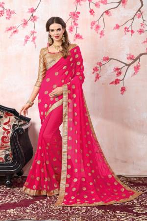 Bright And Visually Appealing Color Is Here With This Saree In Fuschia Pink Color Paired With Golden Colored Blouse. This Saree Is Fabricated On Georgette Paired With Brocade Fabricated Blouse. Buy This Saree Now.