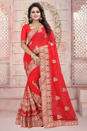 Adorn The Angelic Look Wearing This Saree In Red Color Paired With Red Colored Blouse. This Saree And Blouse Are Fabricated On Georgette Beautified With Heavy Embroidery. Buy This Attractive Looking Saree Now.