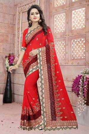 Adorn The Angelic Look Wearing This Saree In Red Color Paired With Red Colored Blouse. This Saree And Blouse Are Fabricated On Georgette Beautified With Heavy Embroidery. Buy This Attractive Looking Saree Now.