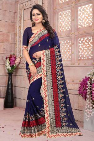 Enhance Your Personality In Dark Colors Wearing This Saree In Navy Blue Color Paired With Navy Blue Colored Blouse. This Saree And Blouse Are Fabricated On Georgette Beautified With Heavy Resham And  Jari Embroidery All Over It. Buy This Saree Now.