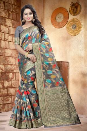 Flaunt Your Rich and Elegant Taste Wearing This Elegant Looking Saree In Grey Color Paired With grey Colored Blouse. This Saree And Blouse are fabricated On Linen Beautified With Multi Colored Prints all Over. Buy This Saree Now.