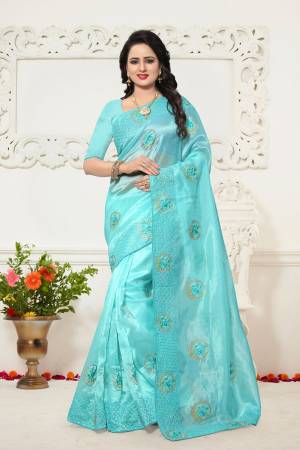 Lovely Shade In Blue Is Here With This Pretty Saree In Aqua Blue Color Paired With Aqua Blue Colored Blouse. This Saree Is Fabricated On Orgenza Paired With Art Silk Fabricated Blouse. This Pretty Saree Will Definitely Earn You Lots Of Compliments From Onlookers.