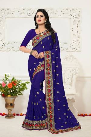 Bright And Visually Appealing Color Is Here With This Designer Saree In Royal Blue Color Paired With Royal Blue Colored Blouse. This Saree And Blouse Are Fabricated On Georgette Beautified With Contrasting Embroidered Lace Border.