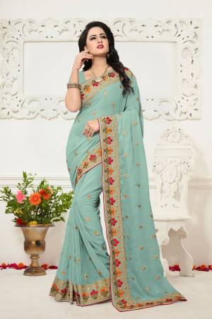 You Will Definitely earn Lots Of Compliments Wearing This Pretty Saree In Baby Blue Color Paired With Baby Blue Colored Blouse. This Saree And Blouse Are Fabricated On Georgette Beautified With Contrasting Thread Work.