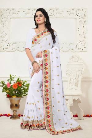 Adorn a Pretty Look Wearing this Designer Saree In White Color Paired With White Colored Blouse. This Saree And Blouse are Fabricated On Georgette Beautified With Multi Colored Thread Work . Buy This Saree Now.