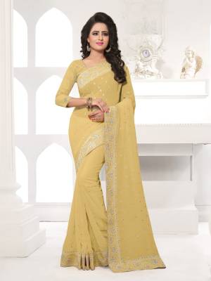 Featuring An Eye Catching design with This Beautiful Designer Saree In Beige Color Paired With Beige Colored Blouse. This Saree And Blouse are Fabricated On Georgette Beautified With Attractive Embroidery. This Pretty Design Is Available In Many Colors.