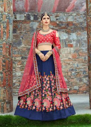 Featuring a Dark Blue Colored lehenga in mulbari silk base with floral embroidery at the bottom. It is paired with a pink sweetheart neck embroidery blouse with flower work embroidered dupatta.